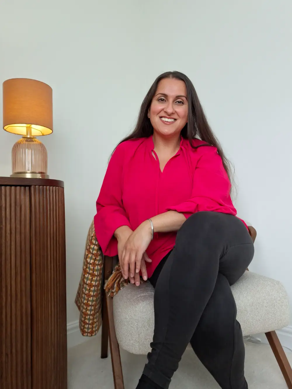 Gurpal Bharj smiling in her therapy room