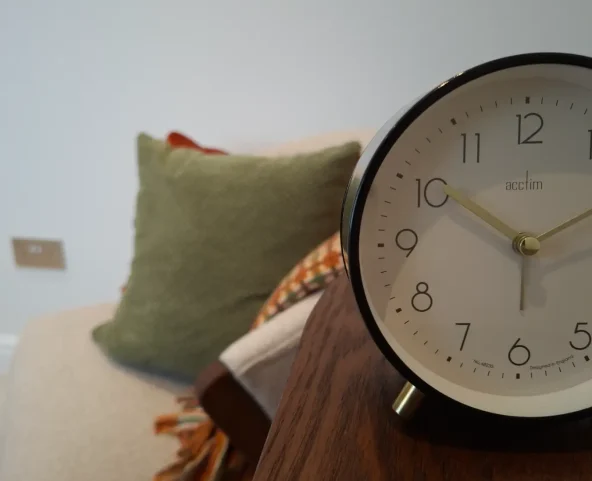Clock and cushions in a counselling room